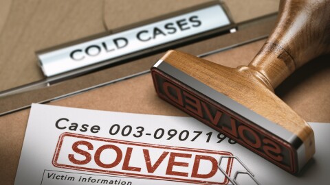 3D illustration of a cold case file with a rubber stamp and the word solved. concept of successful police investigations