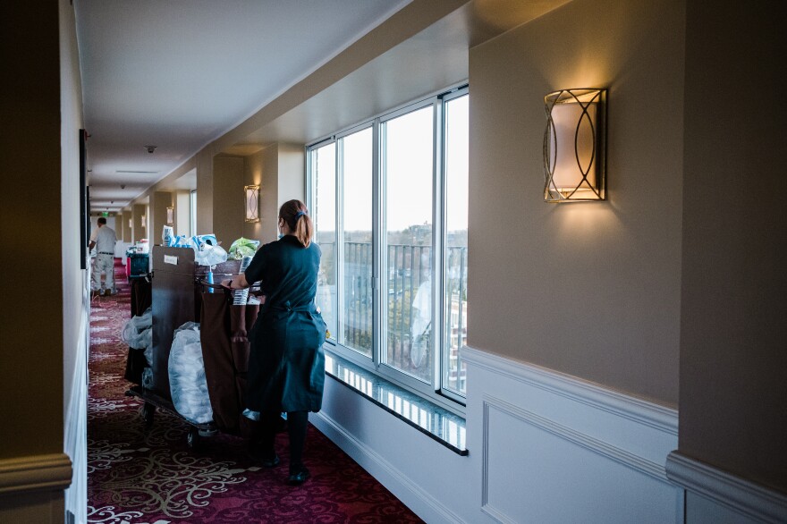 A robot vacuum supplements the labor of housekeeping staff at Garden City Hotel, saving them the 40 minutes it takes to vacuum the corridor and elevator lobby on each floor.