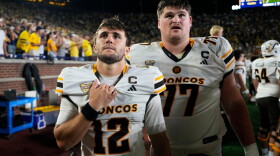 Western Michigan quarterback Broc Lowry (12) and Hunter Whitenack (77) watch from the bench at the end of the second half of an NCAA college football game against the Michigan Saturday, Sept. 5, 2026, in Ann Arbor, Mich.