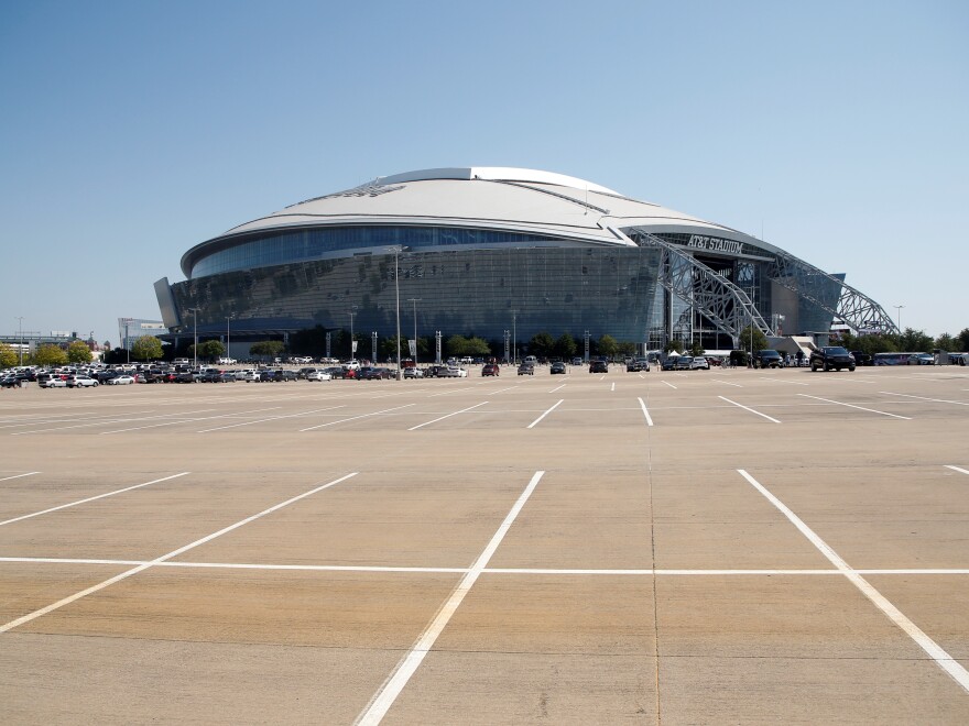 The exterior of AT&T Stadium is shown in this general, overall view before an NFL football game between the Dallas Cowboys and the New York Giants in Arlington, Texas, Sunday, Oct. 11, 2020. (AP Photo/Michael Ainsworth)