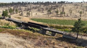 Cyclists cross a century-old trestle near Rosalia on the John Wayne Trail, now the Palouse to Cascades State Park Trail, which runs 253 miles across Washington.