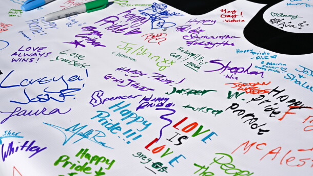 Signatures and messages of hope cover the banner to be held during TulsaPride Parade Saturday, Oct. 17.