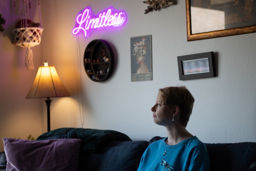Lilo Baurer, who attended Calo in 2017 and 2018, poses for a portrait Thursday, May 21, 2026, at their apartment in Iowa City. Baurer graduated last month with a bachelor's degree in social work from the University of Iowa. They are now in a master's program at the university and plan to become a social worker.