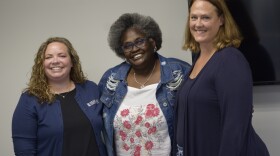 Three women posting for photo