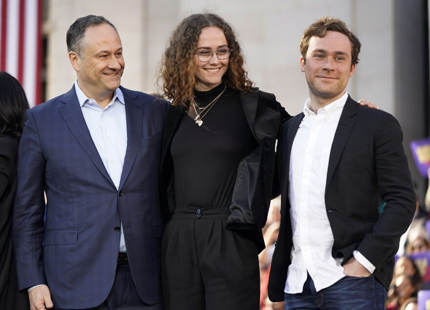 Doug Emhoff (left), husband of Vice President-elect Kamala Harris, and children Ella and Cole Emhoff stand onstage after Harris launched her presidential campaign at a rally in Oakland, Calif., on Jan. 27, 2019.