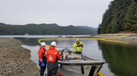 U.S. Coast Guard and Hecla Greens Creek Mine crews deploy a boom April 3, 2019 to contain a fictitious heavy fuel oil spill at Hawk Inlet. (Photo courtesy of Coast Guard Sector Juneau)