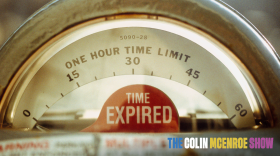 Close-up of a parking meter with a red "time expired" notification. 
