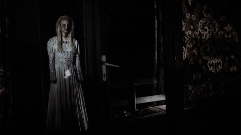 Scary witch in the mirror.