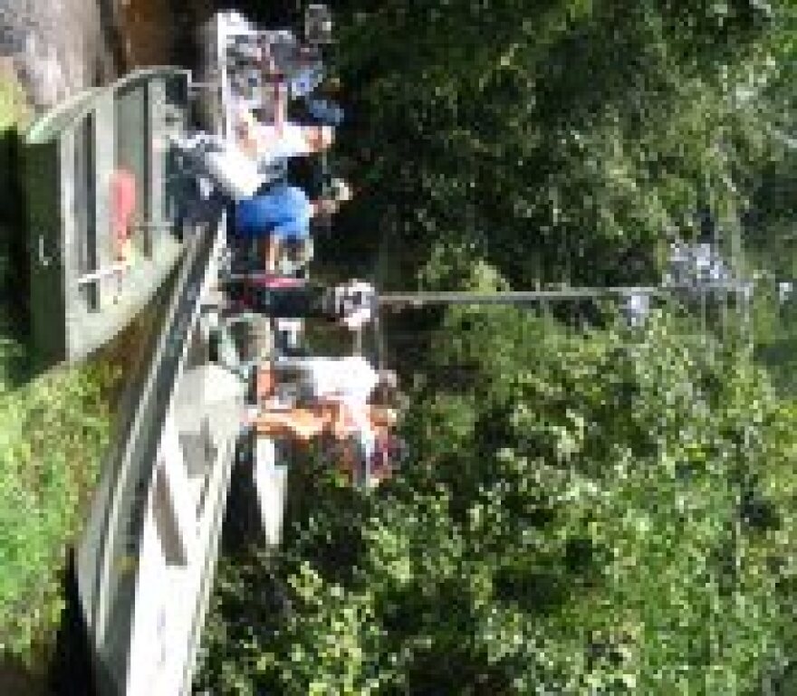 Wildlife Officers, and news crews, prepare to tour flooding along Highway 53.