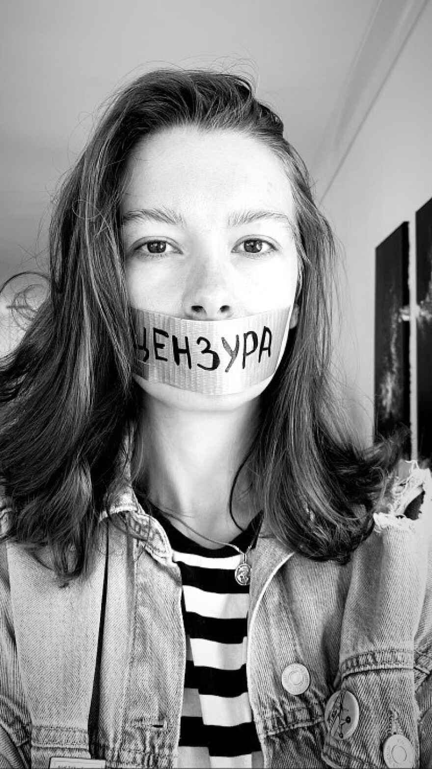 Russian-American Aleksandra Degernes is torn between two worlds as she watches her motherland invade Ukraine. The word "CENSORED" is written across the tape.