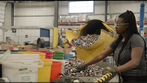 A worker at Cirba Solutions' Wixom facility sorts household batteries. Cirba, a Michigan-based company, recycles batteries by breaking them down into their component parts, and produces a substance called black mass that contains some of the coveted rare earth minerals.
