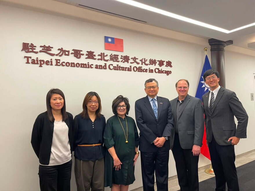 Dennis Lei (third from right) welcomed Iowa Economic Development Authority director Debi Durham to his Chicago office in June 2026.