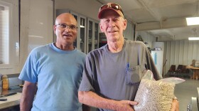 Srinivasa Pinnamaneni, Ph.D from Colorado State University joins Delta farmer Mike Ahlberg as he shows off first commercially grown black eyed peas on the Western Slope