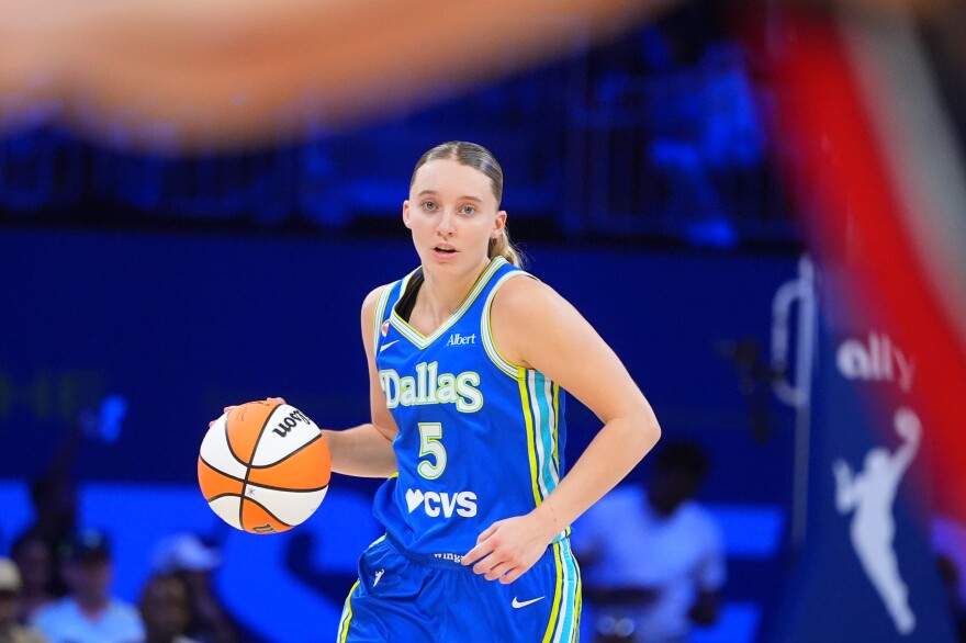 Dallas Wings guard Paige Bueckers dribbles during the second half of a WNBA basketball game against the Washington Mystics in Arlington, Texas, Monday, May 18, 2026.