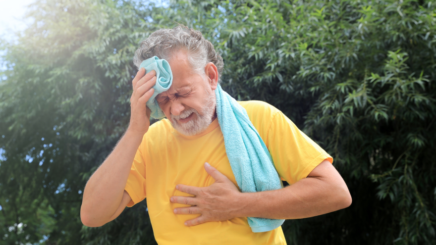 File photo: Senior man suffering from heat stroke outdoors.