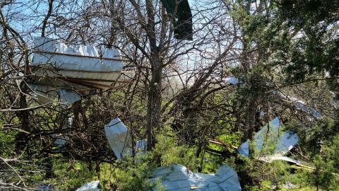 Parts of a silo ended up in trees along the perimeter of Archer Bethel Cemetery in McDonough County.