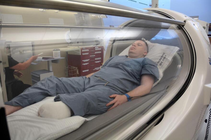 Army Capt. Kyle Salik receives hyperbaric oxygenation therapy at Brooke Army Medical Center in June 2017.