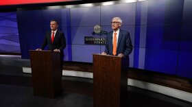 Wisconsin Republican gubernatorial candidate Tim Michels, left, and Democratic gubernatorial candidate Tony Evers prepare for a televised debate Friday, Oct. 14, 2022, in Madison, Wis.