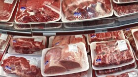 Various cuts of beef and pork are displayed for sale in the meat department at a discount market in Arlington, Va.