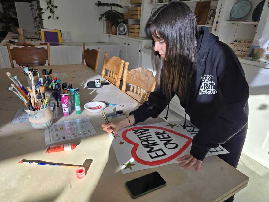 Eucalyptus and Company was offering all sorts of supplies to make signs, asking people to make a donation to a Minneapolis immigrants' rights group.