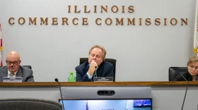 Illinois Commerce Commission Chair Doug Scott is pictured alongside commissioners Michael Carrigan (left) and Ann McCabe (right) at a November 2023 meeting in Springfield.