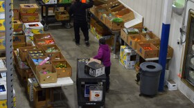 Fairbanks Food Bank volunteers organize boxes of produce on Nov. 7, 2025.