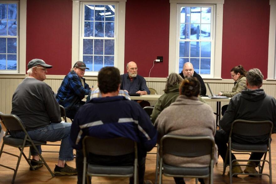 Grafton Selectboard Chair Ed Grinley, left, and members Steve Darrow and Leif Hogue discuss the police chief position during a selectboard meeting on Tuesday, March 17, 2026, in Grafton, N.H. On the right is Sara Hogue, the administrative assistant.