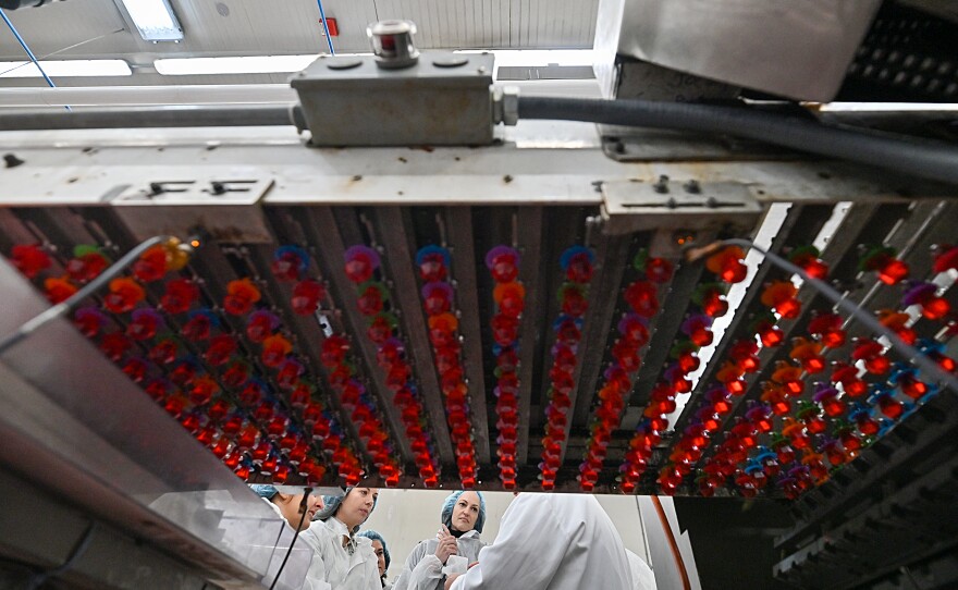 Ring Pops pass on a conveyor to be wrapped at the new Ring Pops factory in Moosic.