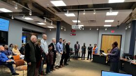 Members of the Community Advisory Committee stand in a line while being sworn in by GCRTA  Deputy General Manager of Legal Affairs Janet Burney. 