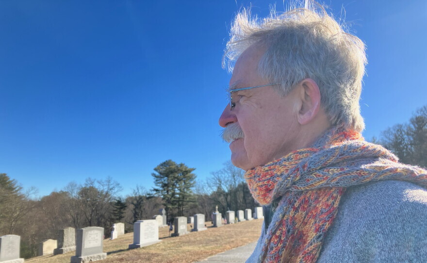 Terry McKiernan, president of BishopAccountability.org, visits a cemetery in Douglas where Phil Saviano is buried. Saviano was a board member of BishopAccountability.org and a