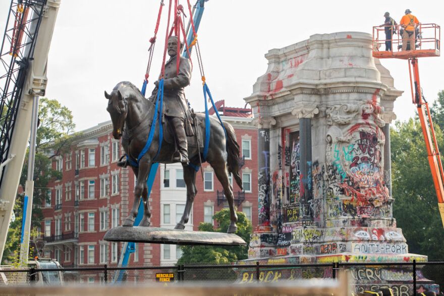 Robert E. Lee statue is removed from its pedestal in Richmond, Va.