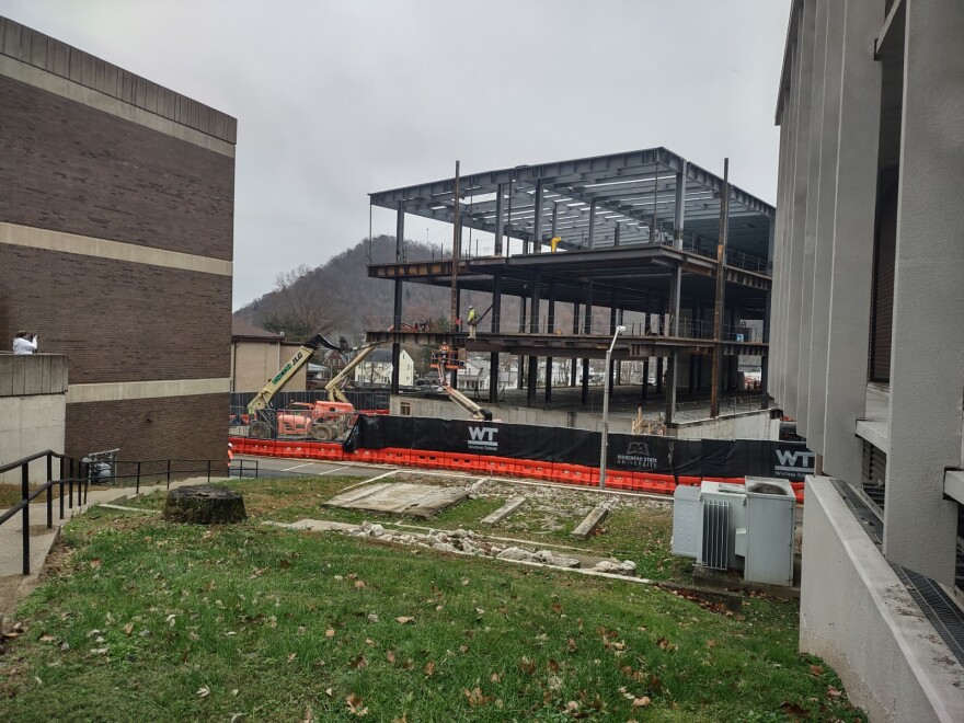 The new science and engineering building as viewed from the corner of the Howell-McDowell Building while workers prepared to install the finial structural beam.