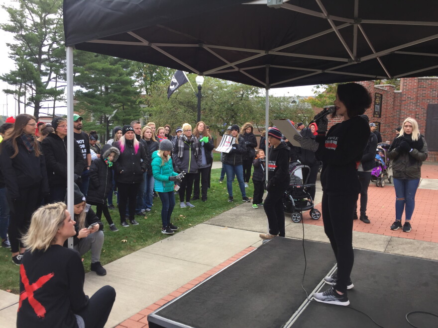 Kathie Gray (standing) and Heather Scott (lower left) helped found the North Canton non-profit Not For Sale: One Step at a Time, which sponsored Saturday's event.