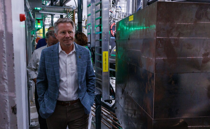Michigan State University President Kevin Guskiewicz tours the Facility for Rare Isotope Beams in East Lansing, Mich., with U.S. Sen. Gary Peters and FRIB Laboratory Director Thomas Glasmacher on Aug. 28, 2026. The visit was the last stop on Peters' final motorcycle tour of Michigan as senator.