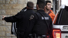 Luigi Nicholas Mangione is escorted into Blair County Courthouse, Tuesday, Dec. 10, 2024, in Hollidaysburg, Pa. (AP Photo/Gary M. Baranec)