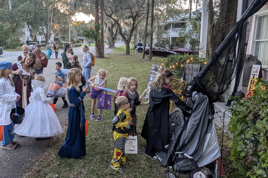Children line up at McIntosh Mayor Alison Scott’s two-story house, which was built in 1895 as the town’s hotel, to receive candy from a PVC pipe chute on Halloween. (Courtesy of Alison Scott)