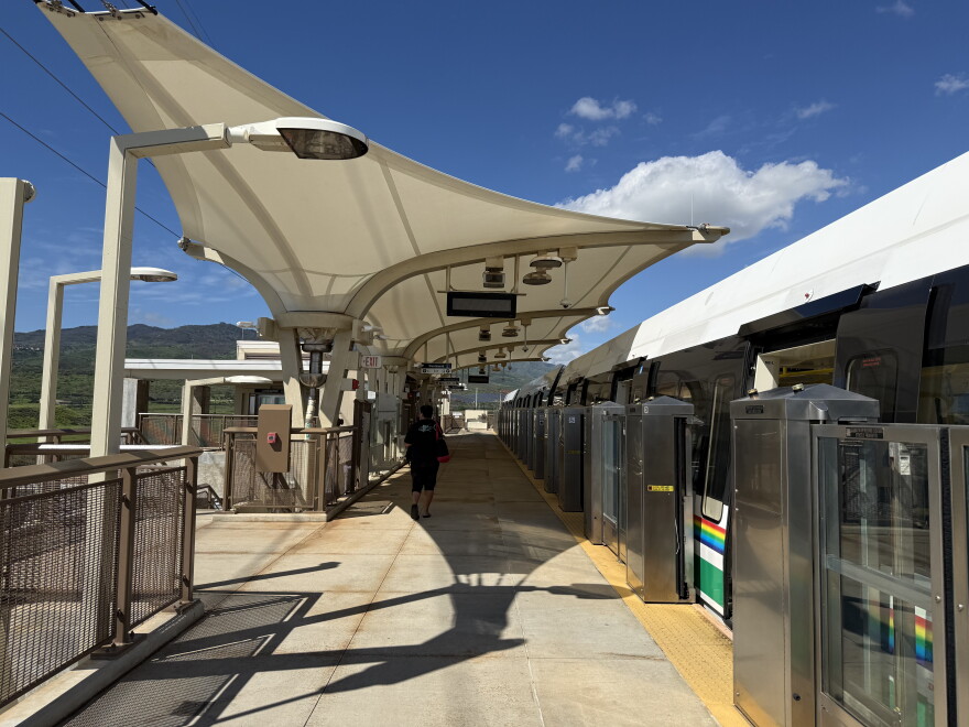 A passenger is seen walking around at Skyline's Keoneʻae station (also known as the University of Hawaiʻi West Oʻahu station).