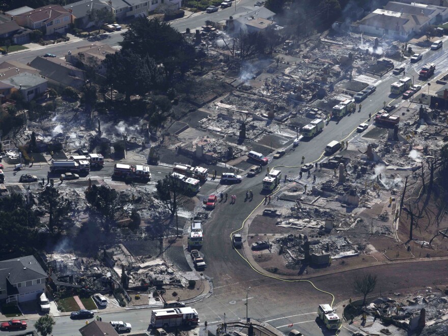 A Sept. 10, 2010 photo showing firefighters and rescue crews working amid damage caused by the pipeline explosion in San Bruno, Calif.