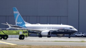 In this June 29, 2020, file photo, A Boeing 737 MAX jet taxis after landing at Boeing Field following a test flight in Seattle. Boeing will pay $2.5 billion to settle a criminal charge related to its troubled 737 Max jetliner.