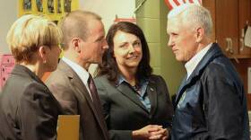 Gov. Mike Pence (right) greets Early Learning Indiana CEO Ted Maple (second from left) and Melanie Brizzi of the FSSA (second from right) at Wayne Township Preschool Thursday.