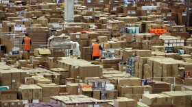 Staff at the Amazon Swansea fulfillment center process orders in November 2010. (Matt Cardy/Getty Images)
