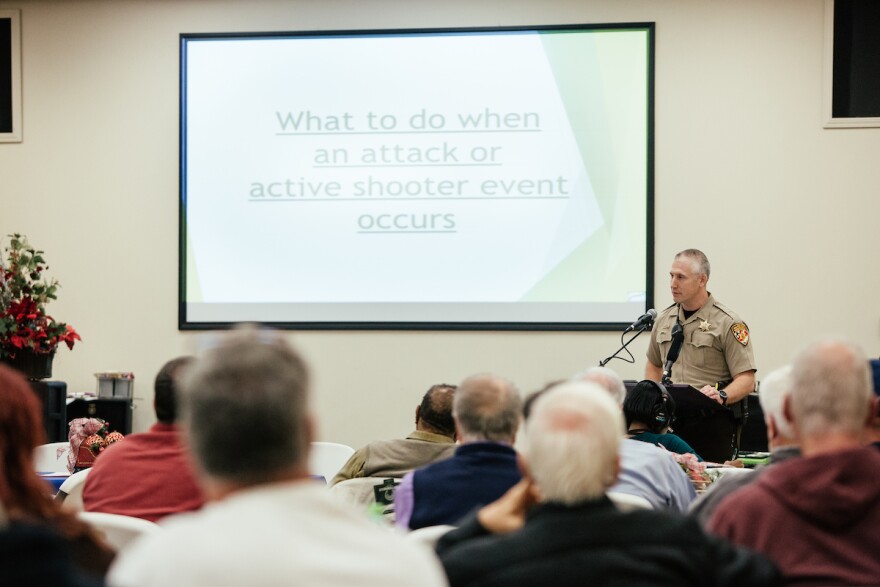 Guilford County Deputy Dan Harris speaks during a seminar on active shooter safety at Calvary Baptist Church in McCleansville, N.C. on December 5, 2017.