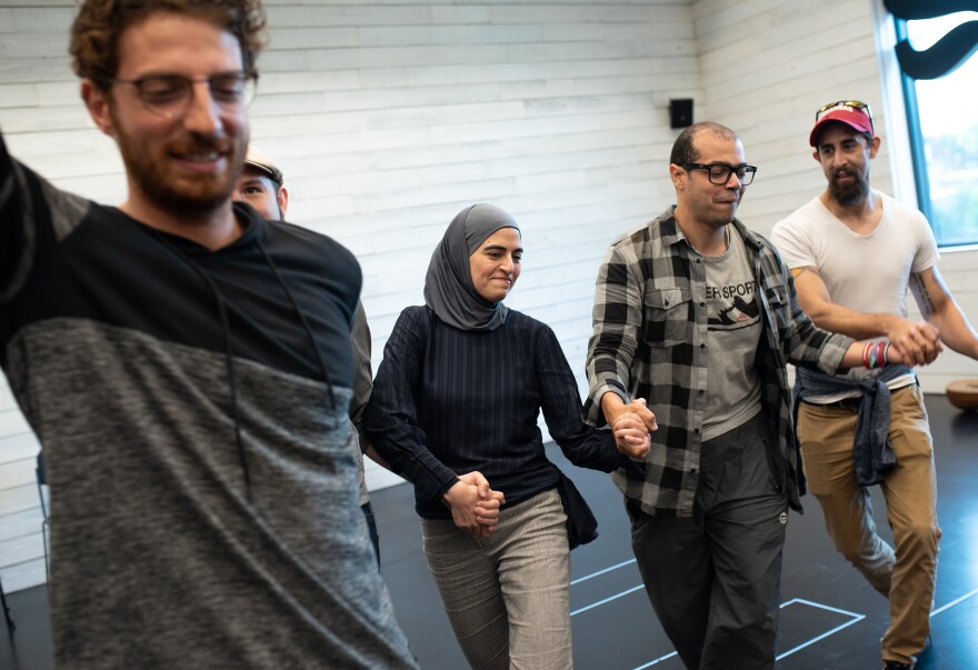 Kholoud Sawaf (second from left) participates in a community workshop discussing cultural elements of her play.