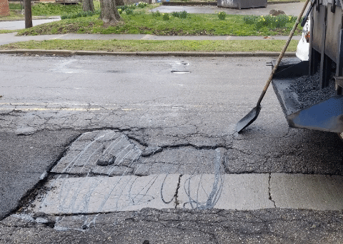 How to patch a pothole in four pictures.