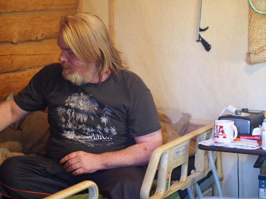 Scott Harrison spends most of each day on a hospital bed that stopped working after a water-leak this fall shorted it out. Photo: Zachariah Hughes.