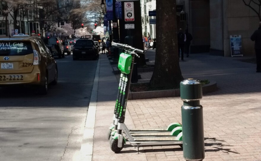 Scooters lined up on South Tryon Street in uptown Charlotte Wednesday. 