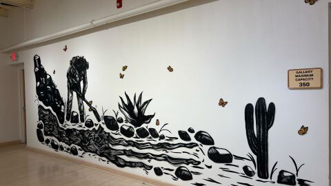 Tirado's work covered the walls and displaying everyday moments spent with relatives.