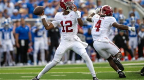 Alabama quarterback Keelon Russell (12) drops back to pass during the first half of an NCAA college football game against Kentucky, Saturday, Sept. 12, 2026, in Lexington, Ky. (AP Photo/Tony Wagner)