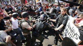 White nationalists, neo-Nazis and members of the "alt-right" clash with counter-protesters in Charlottesville, Virginia during the "Unite the Right" rally August 12, 2017.