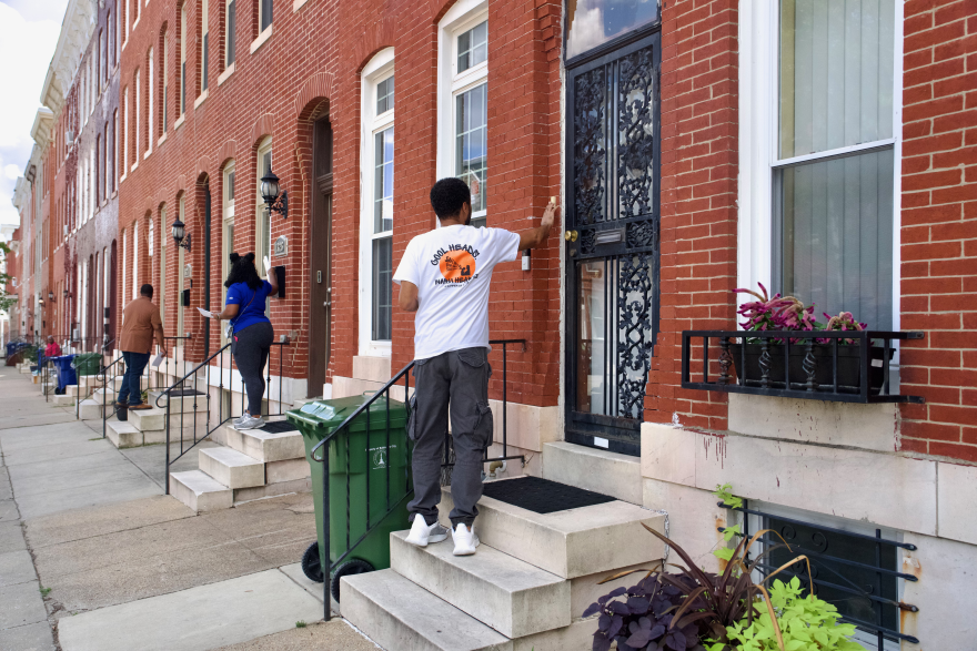 MONSE workers canvass this block following a mass shooting that killed one and injured eight others on Aug. 18